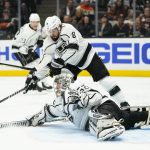 
              Los Angeles Kings' Drew Doughty, top, helps goaltender Jonathan Quick make a save against the Anaheim Ducks during the second period of an NHL hockey game Friday, Feb. 25, 2022, in Anaheim, Calif. (AP Photo/Jae C. Hong)
            