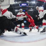 
              Russian Olympic Committee's Kirill Semyonov (94), second from right, celebrates after a shot by teammate Anton Slepyshev, not shown, gets past Switzerland's goalkeeper Reto Berra (20) for a goal during a preliminary round men's hockey game at the 2022 Winter Olympics, Wednesday, Feb. 9, 2022, in Beijing. (AP Photo/Matt Slocum)
            