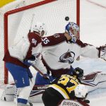 
              Boston Bruins' Patrice Bergeron scores on Colorado Avalanche goaltender Darcy Kuemper during the second period of an NHL hockey game Monday, Feb. 21, 2022, in Boston. (AP Photo/Winslow Townson)
            