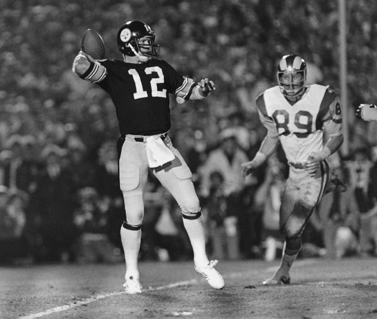 FILE - Pittsburgh Steelers quarterback Terry Bradshaw (12) cocks his arm to pass during NFL footbal...
