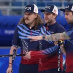 
              United States' Matt Hamilton, left, John Shuster, centre, and Christopher Plys discuss during a men's curling semifinal match between Britain and the United States at the Beijing Winter Olympics Thursday, Feb. 17, 2022, in Beijing. (AP Photo/Brynn Anderson)
            