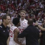 
              Wisconsin forward Steven Crowl (22) and guard Chucky Hepburn (23), with head coach Greg Gard, react after a fight broke out on the court at the end of an NCAA college basketball game against Michigan in Madison, Wis., Sunday, Feb. 20, 2022. (Amber Arnold/Wisconsin State Journal via AP)
            