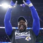 
              Los Angeles Rams' Von Miller holds the George Halas trophy after the NFC Championship NFL football game against the San Francisco 49ers Sunday, Jan. 30, 2022, in Inglewood, Calif. The Rams won 20-17 to advance to the Super Bowl. (AP Photo/Marcio Jose Sanchez)
            