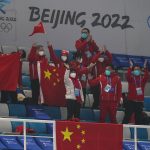 
              Chinese fans cheer after a China win against Australia during the mixed doubles curling match at the Beijing Winter Olympics Thursday, Feb. 3, 2022, in Beijing. (AP Photo/Brynn Anderson)
            