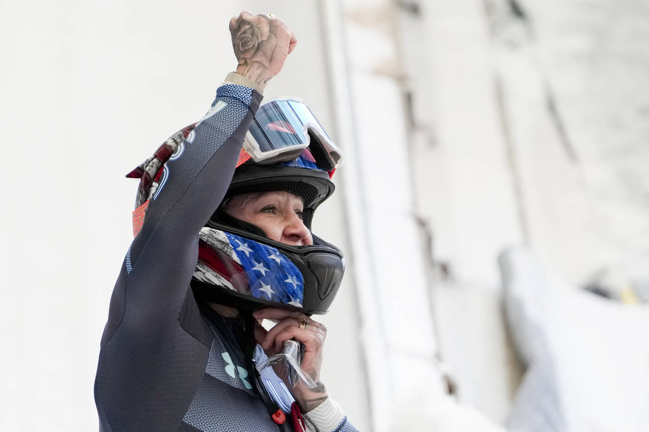 Kaillie Humphries, of the United States, celebrates winning the gold medal in the women's monobob a...