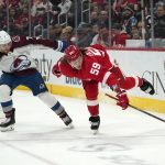 
              Detroit Red Wings left wing Tyler Bertuzzi (59) tries to keep the puck as Colorado Avalanche defenseman Devon Toews (7) defends in the second period of an NHL hockey game Wednesday, Feb. 23, 2022, in Detroit. (AP Photo/Paul Sancya)
            