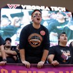 
              Virginia Tech's student section cheers against North Carolina during the first half of an NCAA college basketball game at Cassell Coliseum, Saturday, Feb. 19, 2022, in Blacksburg, Va. (Scott P. Yates/The Roanoke Times via AP)
            
