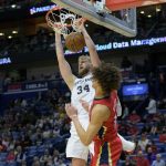 
              San Antonio Spurs center Jock Landale (34) dunks against New Orleans Pelicans center Jaxson Hayes, right, in the first half of an NBA basketball game in New Orleans, Saturday, Feb. 12, 2022. (AP Photo/Matthew Hinton)
            