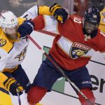 
              Florida Panthers left wing Anthony Duclair (10) and Nashville Predators defenseman Mattias Ekholm (14) battle for the puck during the second period of an NHL hockey game, Tuesday, Feb. 22, 2022, in Sunrise, Fla. (AP Photo/Wilfredo Lee)
            