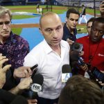 
              FILE - Miami Marlins CEO Derek Jeter, center, talks with members of the media before the start of a baseball game between the Marlins and the St. Louis Cardinals, in Miami, June 10, 2019. Jeter announced a surprise departure from the Miami Marlins Monday, Feb. 28, 2022. (AP Photo/Wilfredo Lee, File)
            