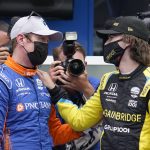 
              FILE - Scott Dixon, of New Zealand, left, talks with Colton Herta after Dixon won the pole for the Indianapolis 500 auto race at Indianapolis Motor Speedway, Sunday, May 23, 2021, in Indianapolis. Dixon and Herta are two of 12 IndyCar drivers taking part in the Rolex 24 at Daytona to knock off some offseason rust ahead of their own season opener next month.(AP Photo/Darron Cummings, File)
            