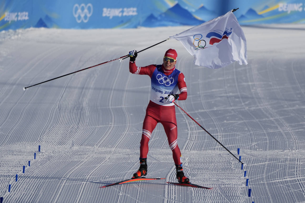 Russian athlete Alexander Bolshunov celebrates before winning the gold medal during the men's 15km ...