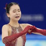 
              Zhu Yi, of China, reacts after the women's team free skate program during the figure skating competition at the 2022 Winter Olympics, Monday, Feb. 7, 2022, in Beijing. (AP Photo/Natacha Pisarenko)
            