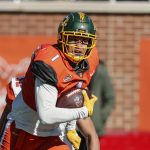 
              National Team wide receiver Christian Watson, of North Dakota State, returns a punt during the first half of an NCAA Senior Bowl college football game, Saturday, Feb. 5, 2022, in Mobile, Ala. (AP Photo/Butch Dill)
            