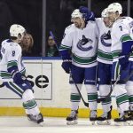 
              Vancouver Canucks left wing Tanner Pearson (70) celebrates with teammates after scoring a goal against the New York Rangers in the first period of an NHL hockey game Sunday, Feb. 27, 2022, in New York. (AP Photo/Adam Hunger)
            