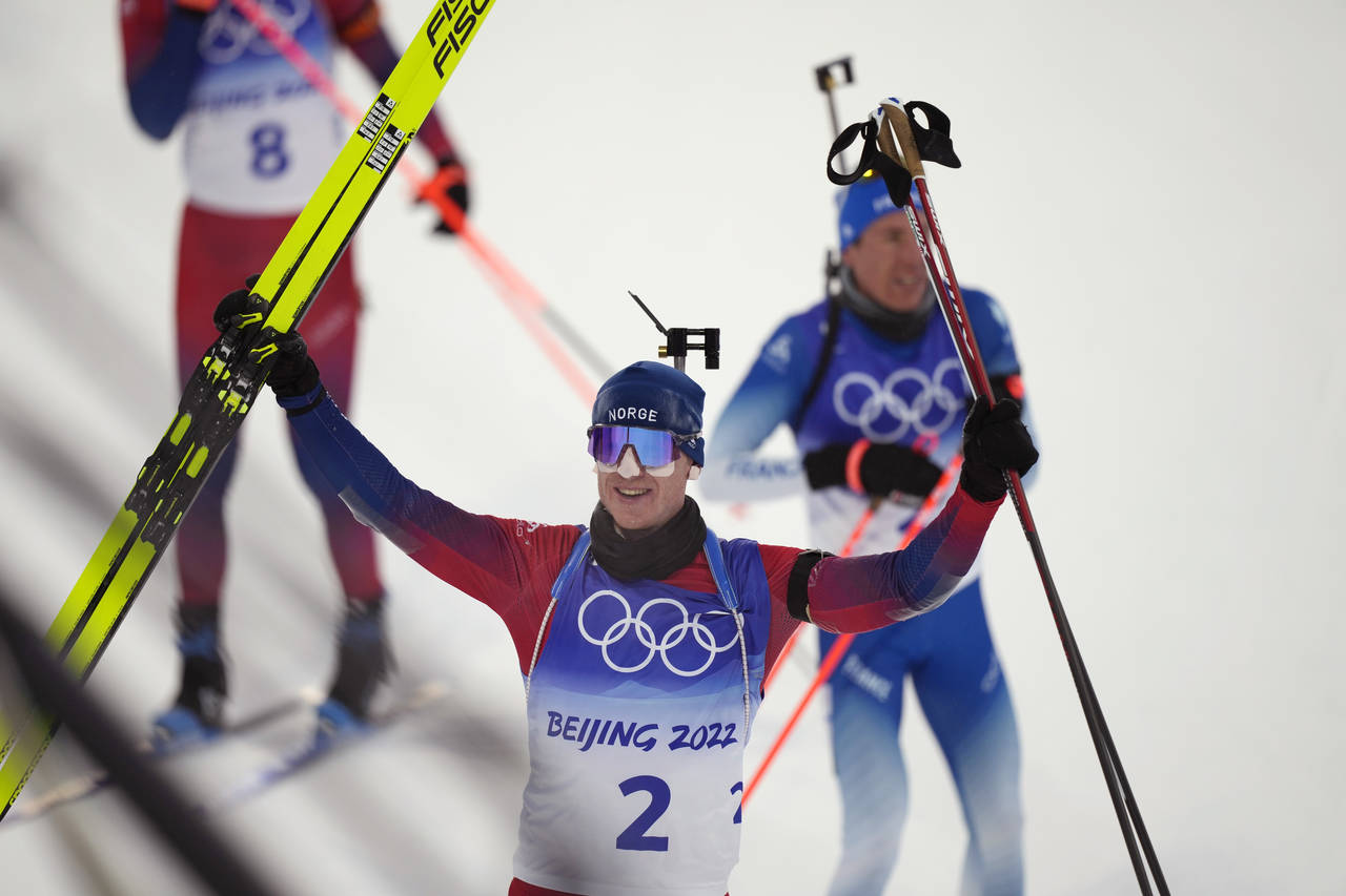 Johannes Thingnes Boe of Norway acknowledges the crowd after winning the men's 15-kilometer mass st...