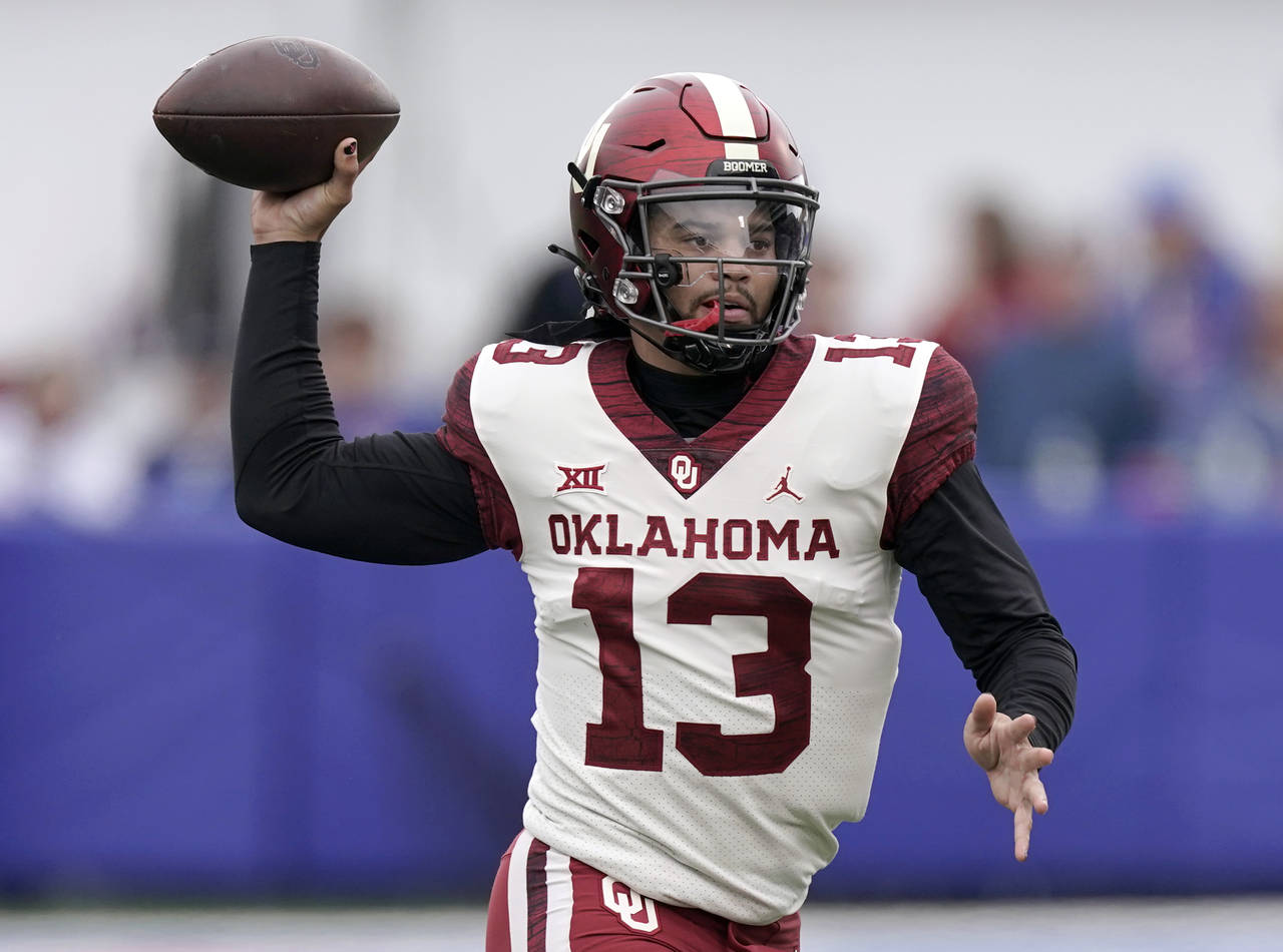 FILE - Oklahoma quarterback Caleb Williams passes the ball during the first half of an NCAA college...
