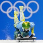 
              Jaclyn Narracott, of Australia, starts the women's skeleton run 2 at the 2022 Winter Olympics, Friday, Feb. 11, 2022, in the Yanqing district of Beijing. (AP Photo/Dmitri Lovetsky)
            