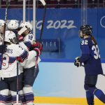 
              United States players celebrate a goal as Finland's Emilia Vesa (32) skates by during a preliminary round women's hockey game at the 2022 Winter Olympics, Thursday, Feb. 3, 2022, in Beijing. (AP Photo/Petr David Josek)
            