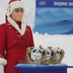 
              Mascots that were presented to the medalists are displayed before the award ceremony for the men's moguls at Genting Snow Park at the 2022 Winter Olympics, Saturday, Feb. 5, 2022, in Zhangjiakou, China. (AP Photo/Gregory Bull)
            