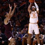 
              Tennessee forward Olivier Nkamhoua (13) shoots over Texas A&M guard Aaron Cash during the first half of an NCAA college basketball game Tuesday, Feb. 1, 2022, in Knoxville, Tenn. (AP Photo/Wade Payne)
            