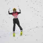 
              Ursa Bogataj, of Slovenia, reacts after her jump during the women's normal hill individual first round at the 2022 Winter Olympics, Saturday, Feb. 5, 2022, in Zhangjiakou, China. (AP Photo/Andrew Medichini)
            