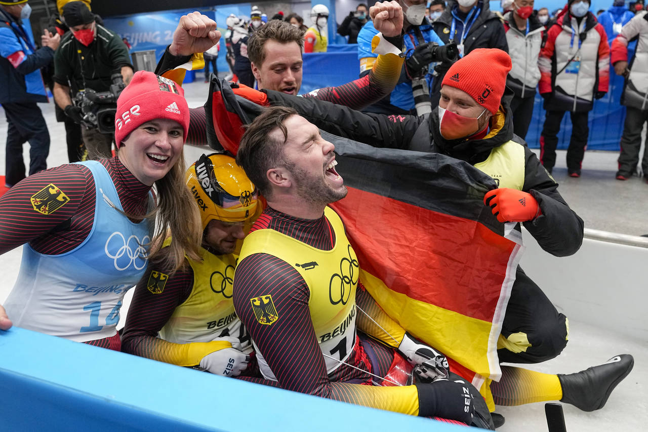 Natalie Geisenberger, Johannes Ludwig, Tobias Wendl and Tobias Arlt, of the Germany, celebrate winn...
