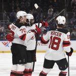 
              New Jersey Devils defenseman P.K. Subban, center, is congratulated after scoring a goal against the St. Louis Blues during the first period of an NHL hockey game Thursday, Feb. 10, 2022, in St. Louis. (AP Photo/Joe Puetz)
            