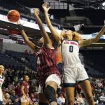 
              Mississippi forward Shakira Austin (0) and South Carolina forward Aliyah Boston (4) battle for a loose rebound during the first half of an NCAA college basketball game in Oxford, Miss., Sunday, Feb. 27, 2022. (AP Photo/Rogelio V. Solis)
            