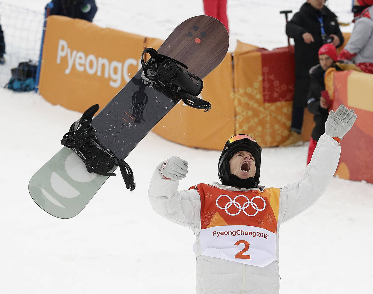 FILE - Shaun White, of the United States, celebrates winning gold after his run during the men's ha...