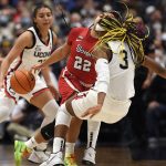 
              St. John's Camree Clegg (22) is fouled by Connecticut's Aaliyah Edwards (3) in the first half of an NCAA college basketball game, Friday, Feb. 25, 2022, in Hartford, Conn. (AP Photo/Jessica Hill)
            