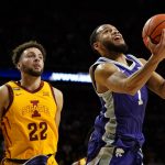 
              Kansas State guard Markquis Nowell (1) drives to the basket ahead of Iowa State guard Gabe Kalscheur (22) during the second half of an NCAA college basketball game, Saturday, Feb. 12, 2022, in Ames, Iowa. (AP Photo/Charlie Neibergall)
            
