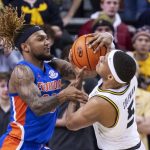 
              Missouri's Jarron Coleman, right, and Florida's Brandon McKissic, left, fight over for the ball during the first half of an NCAA college basketball game Wednesday, Feb. 2, 2022, in Columbia, Mo. (AP Photo/L.G. Patterson)
            