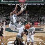 
              Michigan State's Max Christie (5) dunks over Purdue's Eric Hunter Jr. during the second half of an NCAA college basketball game, Saturday, Feb. 26, 2022, in East Lansing, Mich. Michigan State won 68-65. (AP Photo/Al Goldis)
            