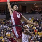 
              Arkansas' Jaylin Williams, left, dunks over Missouri's Jarron Coleman during the first half of an NCAA college basketball game Tuesday, Feb. 15, 2022, in Columbia, Mo. (AP Photo/L.G. Patterson)
            