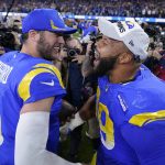 
              Los Angeles Rams' Matthew Stafford, left, and Aaron Donald celebrate after the NFC Championship NFL football game against the San Francisco 49ers Sunday, Jan. 30, 2022, in Inglewood, Calif. The Rams won 20-17 to advance to the Super Bowl. (AP Photo/Marcio Jose Sanchez)
            