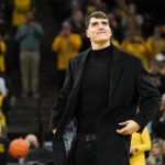 
              Former Iowa player Luka Garza smiles during his jersey number retirement ceremony during halftime of an NCAA college basketball game between Iowa and Michigan State, Tuesday, Feb. 22, 2022, in Iowa City, Iowa. (AP Photo/Charlie Neibergall)
            
