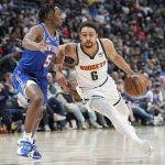 
              Denver Nuggets guard Bryn Forbes, right, drives as New York Knicks guard Immanuel Quickley defends during the second half of an NBA basketball game Tuesday, Feb. 8, 2022, in Denver. The Nuggets won 132-115. (AP Photo/David Zalubowski)
            