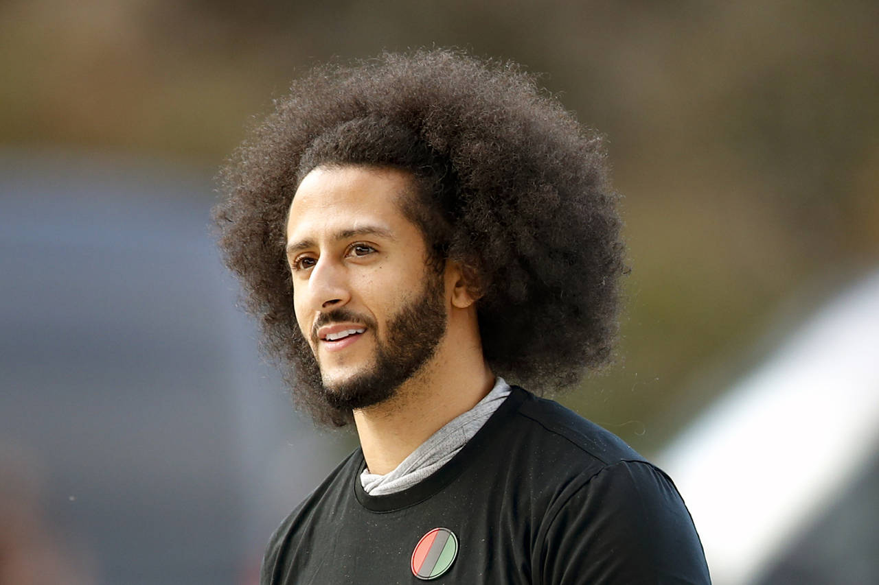 FILE -Free agent quarterback Colin Kaepernick arrives for a workout for NFL football scouts and med...