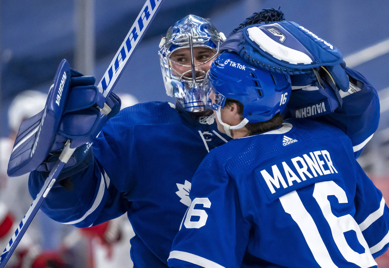 Toronto Maple Leafs goaltender Petr Mrazek (35) and right wing Mitchell Marner (16) celebrate after...