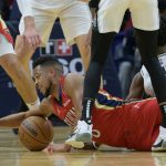 
              New Orleans Pelicans guard CJ McCollum (3) dives for the ball next to San Antonio Spurs guard Joshua Primo (11) in the first half of an NBA basketball game in New Orleans, Saturday, Feb. 12, 2022. (AP Photo/Matthew Hinton)
            