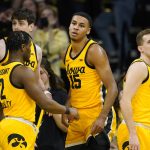 
              Iowa forward Keegan Murray (15) celebrates with teammates after making a basket during the first half of an NCAA college basketball game against Nebraska, Sunday, Feb. 13, 2022, in Iowa City, Iowa. (AP Photo/Charlie Neibergall)
            