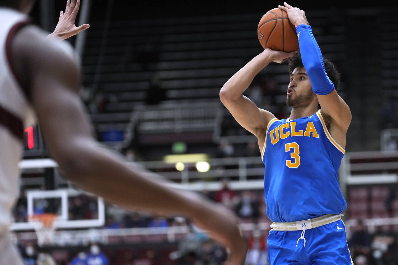 UCLA guard Johnny Juzang (3) takes a 3-point shot against Stanford during the second half of an NCA...