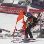 
              A course worker removes a flag from a gate on the men's downhill course after race was postponed due to high winds at the 2022 Winter Olympics, Sunday, Feb. 6, 2022, in the Yanqing district of Beijing. (AP Photo/Alessandro Trovati)
            