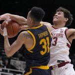 
              California guard Jordan Shepherd (31) is fouled by Stanford forward Brandon Angel (23) during the second half of an NCAA college basketball game in Stanford, Calif., Tuesday, Feb. 1, 2022. Stanford won 57-50. (AP Photo/Tony Avelar)
            