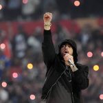 
              Eminem performs during halftime of the NFL Super Bowl 56 football game between the Los Angeles Rams and the Cincinnati Bengals, Sunday, Feb. 13, 2022, in Inglewood, Calif. (AP Photo/Ted S. Warren)
            