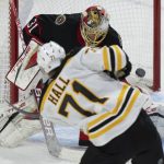 
              Ottawa Senators goaltender Anton Forsberg attempts to block a shot as Boston Bruins left wing Taylor Hall shoots the puck wide of the net during the second period of an NHL hockey game Saturday, Feb. 18, 2022 in Ottawa, Ontario. (Adrian Wyld/The Canadian Press via AP)
            