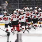 
              Members of the New Jersey Devils celebrate their team's victory over the St. Louis Blues after an NHL hockey game Thursday, Feb. 10, 2022, in St. Louis. (AP Photo/Joe Puetz)
            