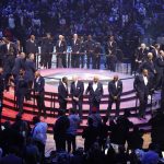 
              75 of the leagues greatest players gather on a stage during halftime at of the NBA All-Star basketball game, Sunday, Feb. 20, 2022, in Cleveland. (AP Photo/Ron Schwane)
            