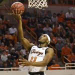 
              Oklahoma State forward Tyreek Smith (23) takes a shot in the first half of an NCAA college basketball game against Oklahoma, Saturday, Feb. 5, 2022, in Stillwater, Okla. Oklahoma State defeated rival Oklahoma 64-55. (AP Photo/Brody Schmidt)
            